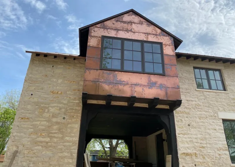Copper metal panel facade on a stone building for Roof Repair in Santa Paula